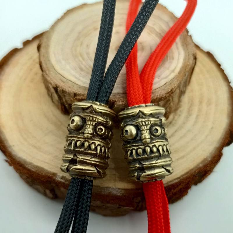 Grin Lantaarn Gezicht Messing  - Paracord Survival Bracelet recensie en prijs